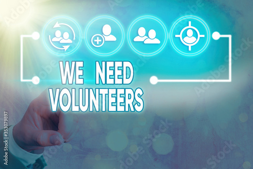 Writing note showing We Need Volunteers. Business concept for someone who does work without being paid for it photo