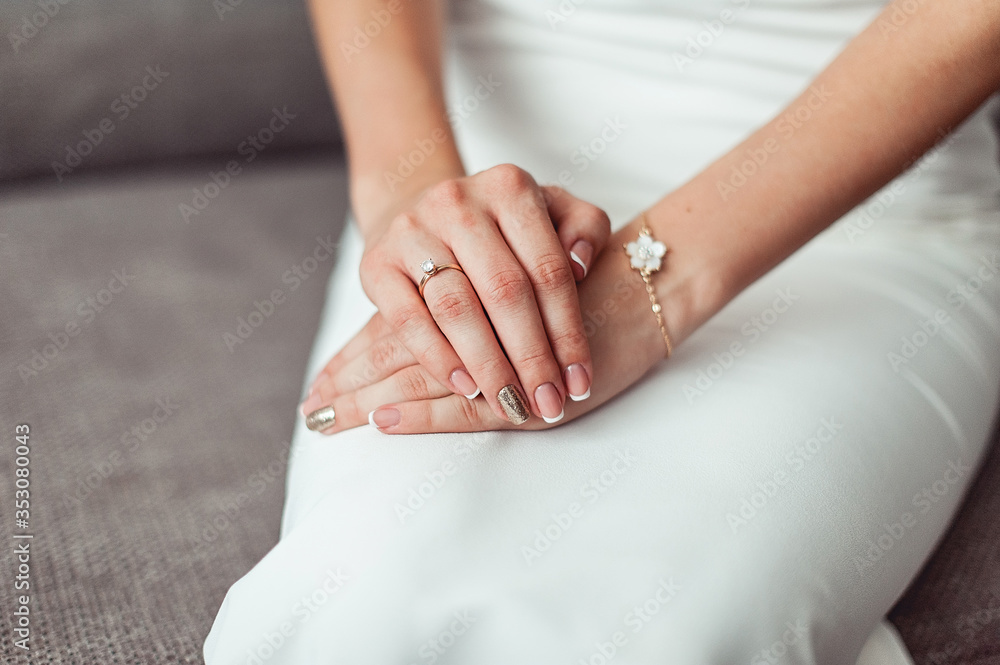 Close up of a brides hand on her lap Close up of a brides hand on her lap