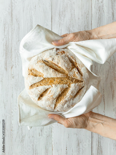 No knead baked bread in a hand.