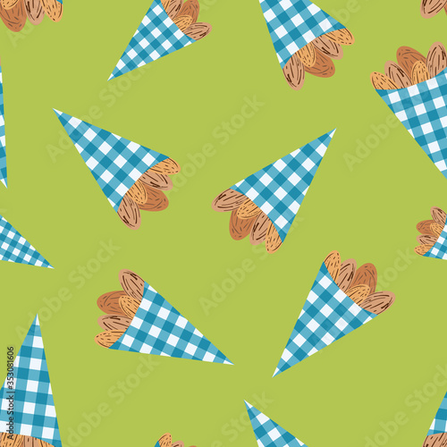 Vector roasted almond nuts in cute blue gingham paper bags seamless pattern background. Brown oval seeds on green backdrop. Kernel shells repeat for food fair, confectionery, farmers market concept