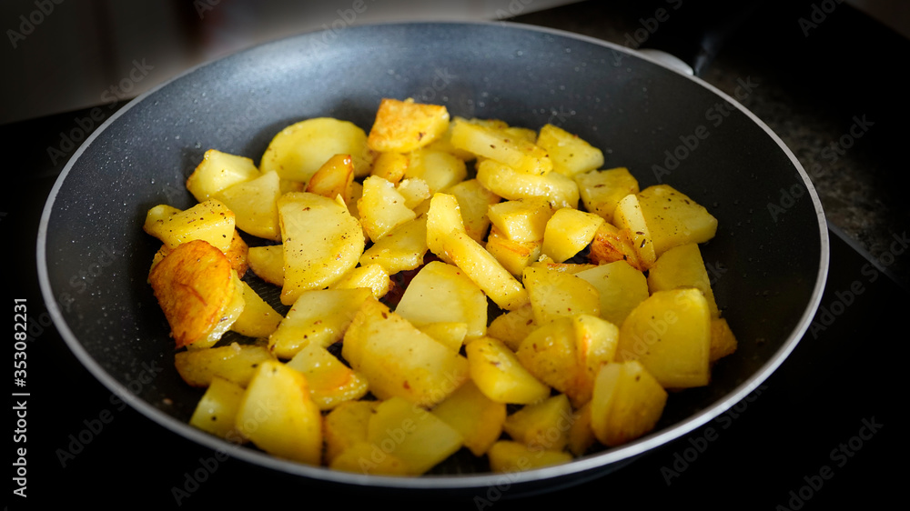fried potatoes in a pan fried potatoes in a pan