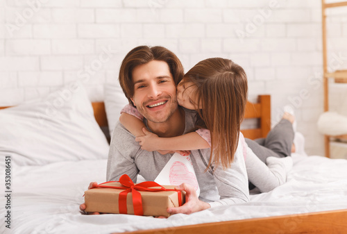 Loving daughter greeting her dad with Father Day