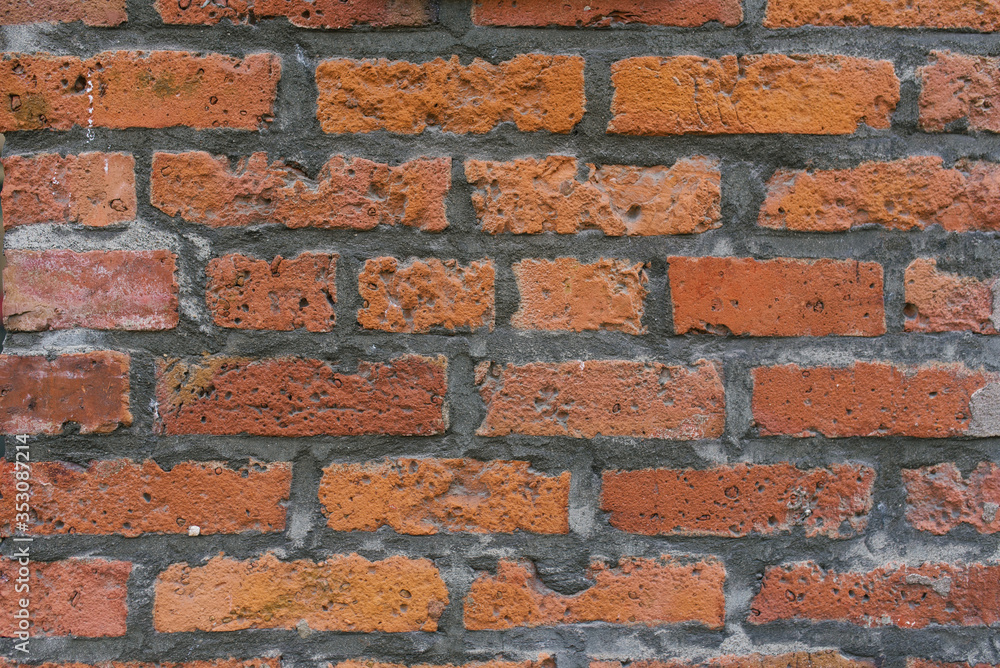 Fototapeta premium Old brick wall of red brick. Copy space background