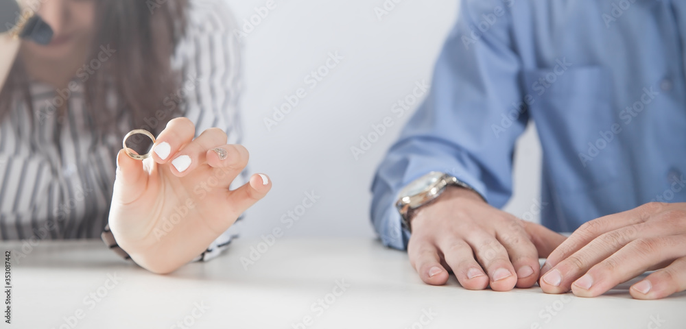 Girl holding wedding ring. Divorce
