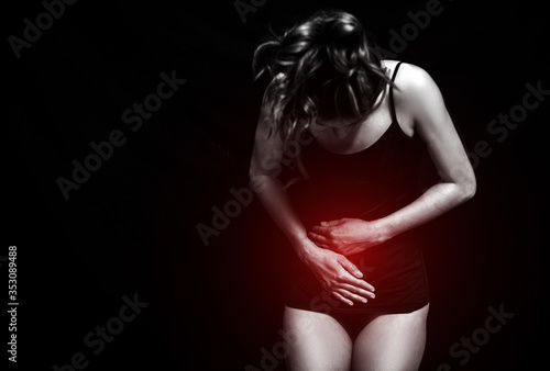 Gynecology concept. Young woman suffering from pain,