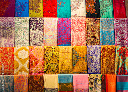 Colourful arabic scarves on display for sale at the souq (market) © carlene