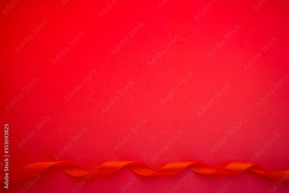 Red paper with red satin ribbon, Love or Gift background Red paper with red satin ribbon, Love or Gift background