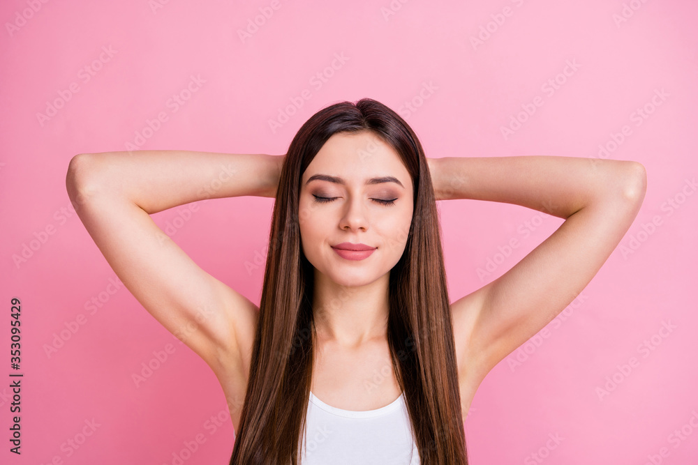 Closeup photo of pretty quiet lady delighted good mood eyes closed napping thinking arms behind head wear casual white singlet isolated pastel pink color background Closeup photo of pretty quiet lady delighted good mood eyes closed napping thinking arms behind head wear casual white singlet isolated pastel pink color background
