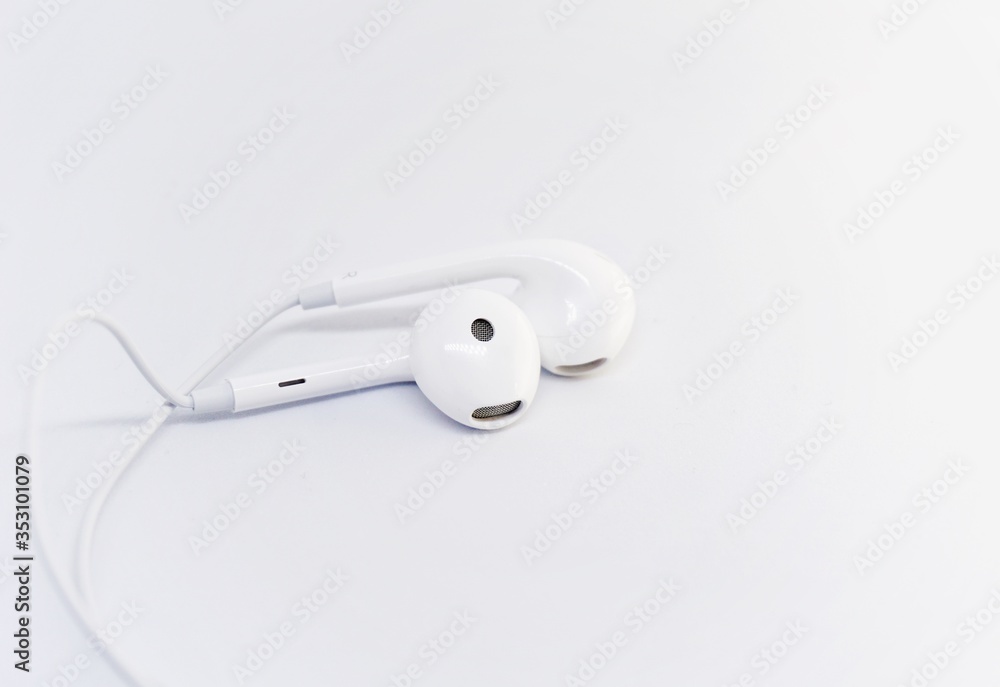 close up of an earphone with white background. close up of an earphone with white background.