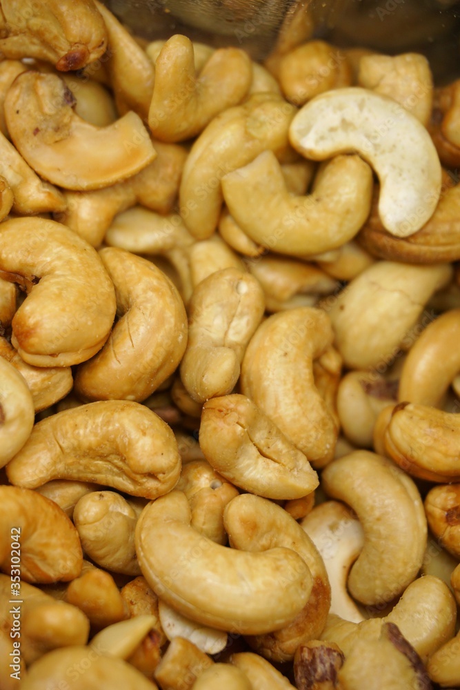 close up of cashew nuts with black background.