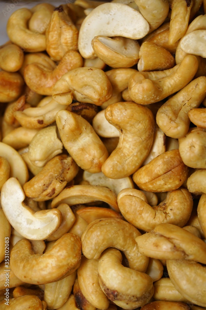 close up of cashew nuts with black background. close up of cashew nuts with black background.