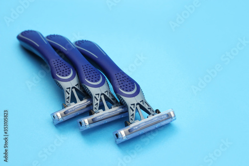 Layout from Shaving razors on a blue background