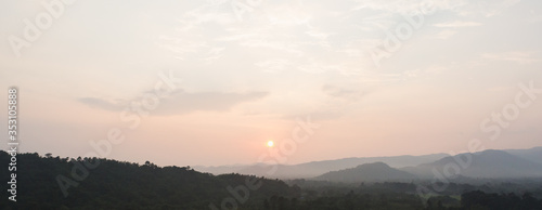 Sunset scene with silhouette mountain at Khun Dan Prakan Chon Dam 