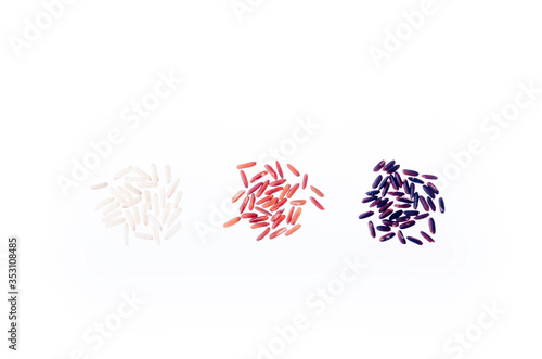 varieties of rice. White, red (reddish), black (brown) rice grains on white background. Asian food