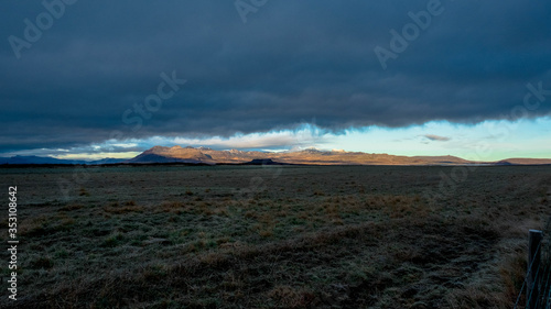 A gigantic cloud covers almost the entire sky except the horizon in Iceland