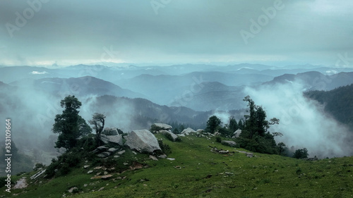 Landscape photograph of foggy mountains photo