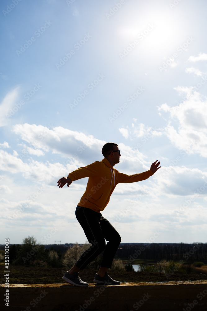 guy tourist freelancer on a background of blue sky with white clouds, bright sunny day, nature and human freedom guy tourist freelancer on a background of blue sky with white clouds, bright sunny day, nature and human freedom