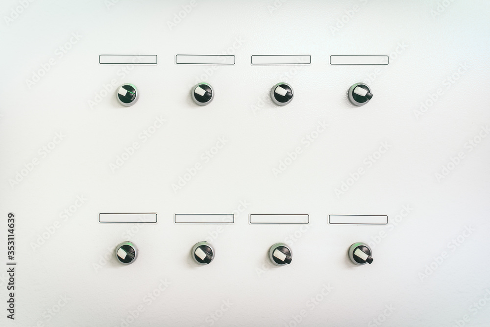 Panel with eight rotary selectors with blank labels. Panel with eight rotary selectors with blank labels.