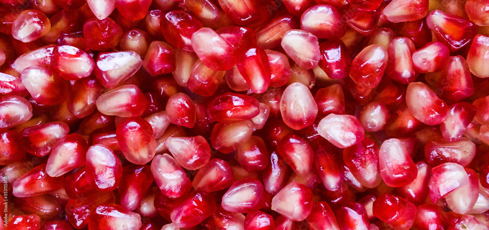 Pomegranate seeds background texture. Pattern. Close up. Healthy food. Pomegranate seeds background texture. Pattern. Close up. Healthy food.