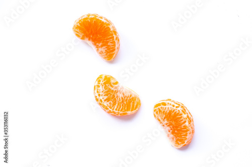 Tangerine slices on a white background