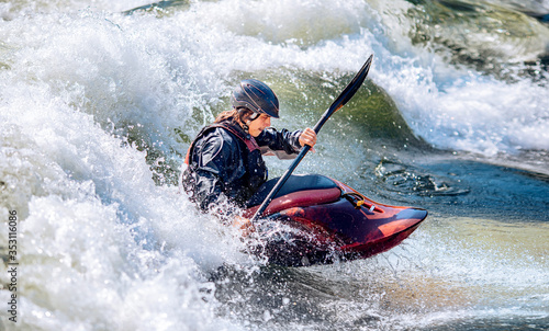 Guy in kayak sails mountain river. Whitewater kayaking, extreme sport rafting © Parilov