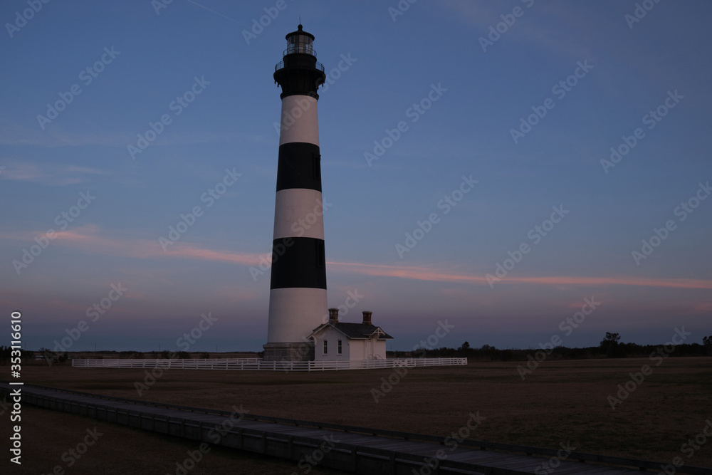 Bodie Island historic Lighthouse in the Cape Hatteras National Seashore at sunset, Outer Banks, North Carolina, USA