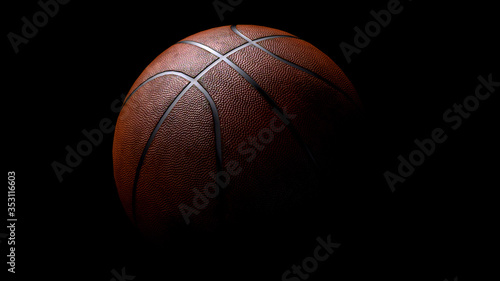3d render basketball lighting from above on black background © mentalrayman