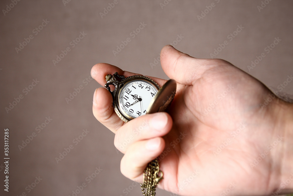 a pocket watch in the hands of a man a pocket watch in the hands of a man