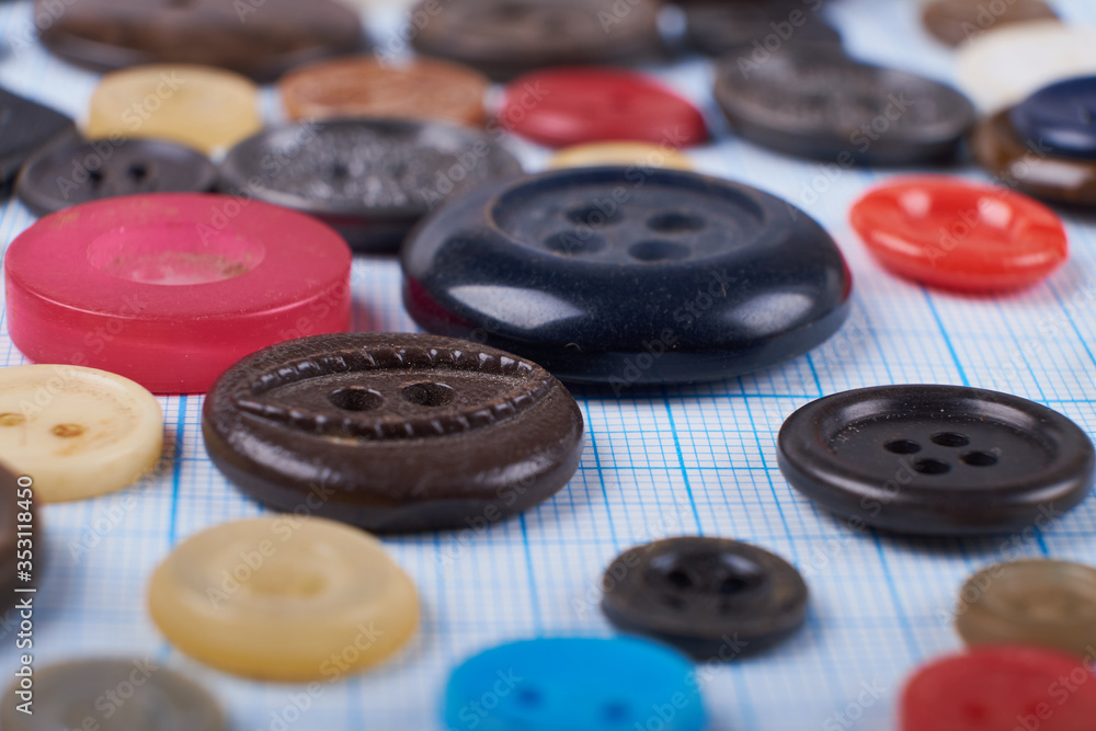 Colorful mixed sewing buttons on black background, flat lay. Top view. Colorful mixed sewing buttons on black background, flat lay. Top view.