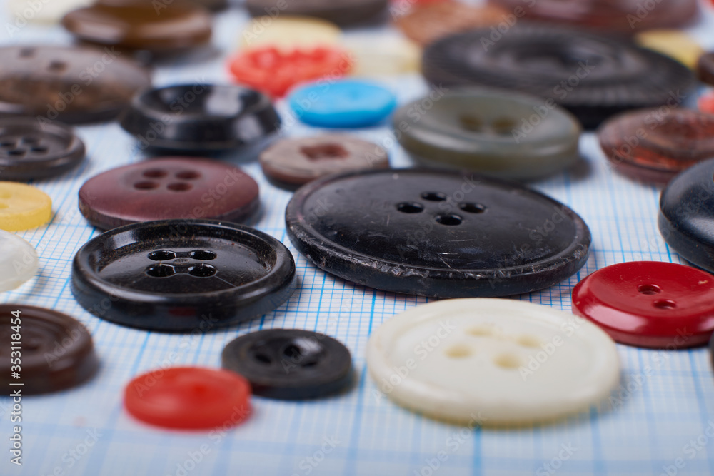 Colorful mixed sewing buttons on black background, flat lay. Top view. Colorful mixed sewing buttons on black background, flat lay. Top view.