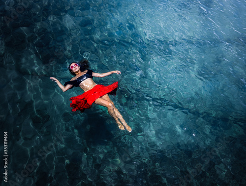 Aerial view of a woman in the sea