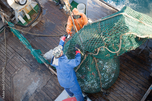 Fishermen lifted a trawl with fish aboard