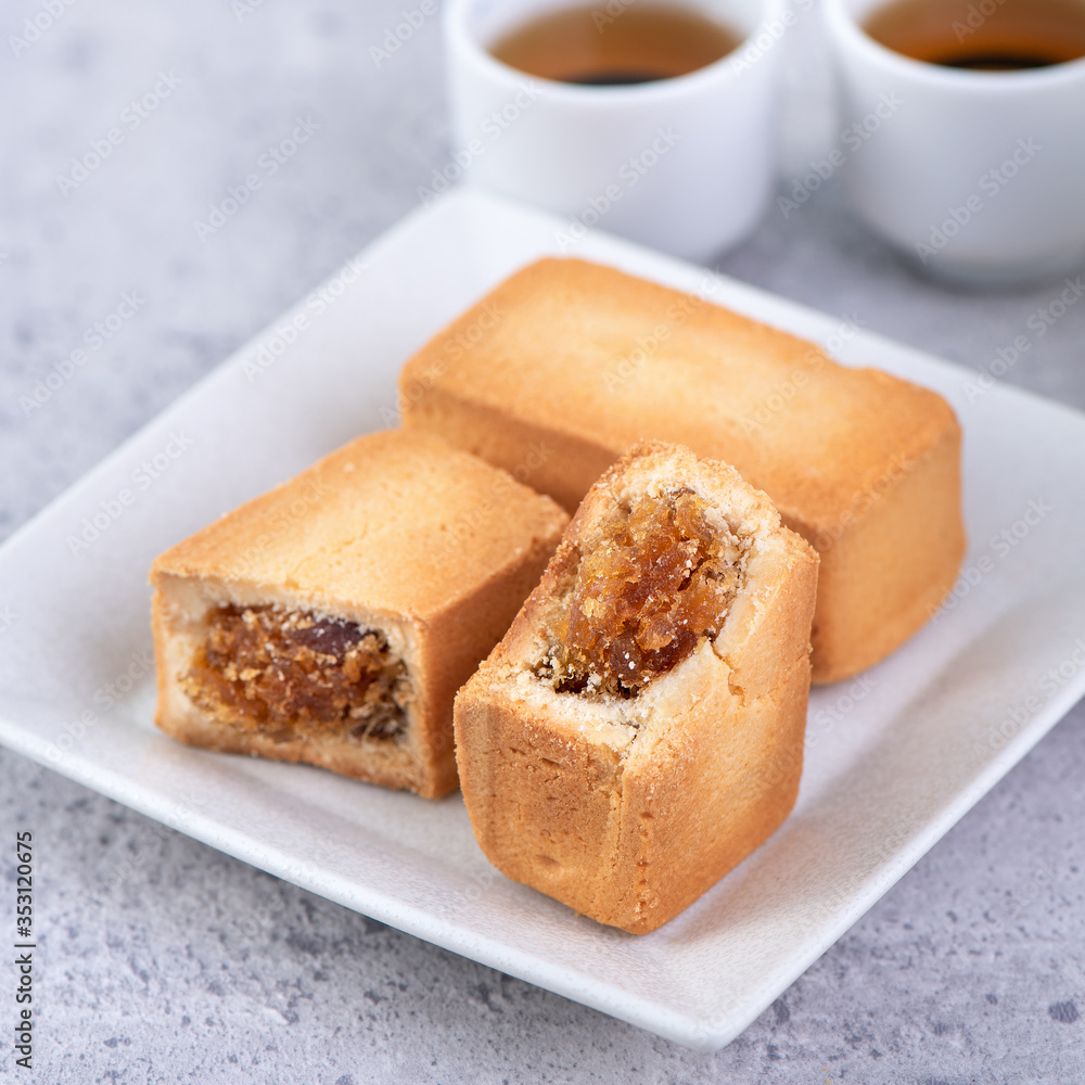 Pineapple cake pastry - Taiwanese famous sweet delicious dessert food with tea, close up, copy space design.