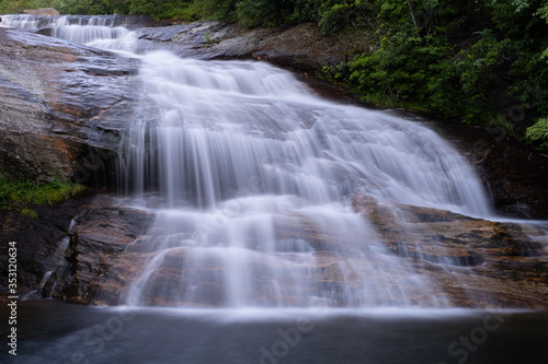 The cascades of the Lower Falls in Graveyard Fields, a very popular waterfall and hiking destination near Asheville, North Carolina in the Blue Ridge Mountains off the Blue Ridge Parkway. © ejkrouse