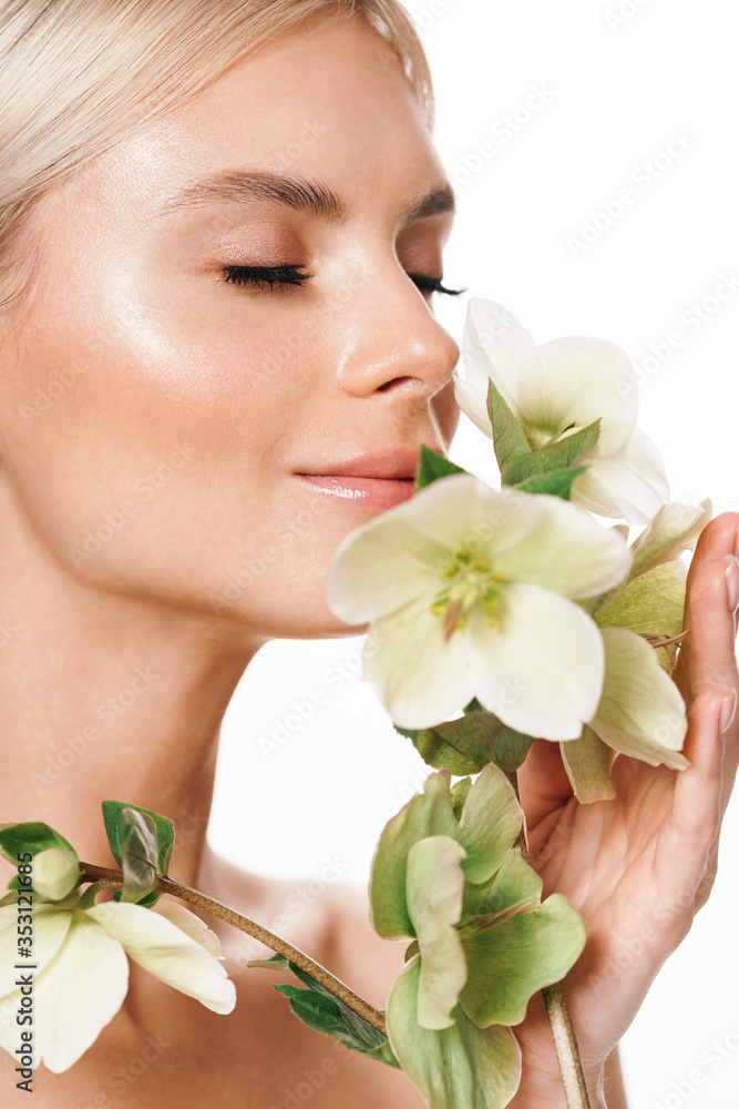 Image of attractive shirtless woman smiling and posing with flower