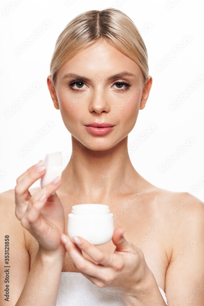 Image of beautiful shirtless woman posing with face cream Image of beautiful shirtless woman posing with face cream