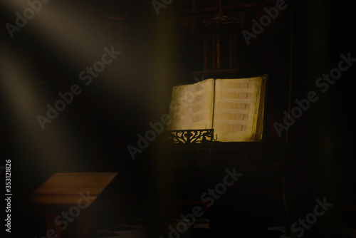Detail of a score on a lectern inside a church
