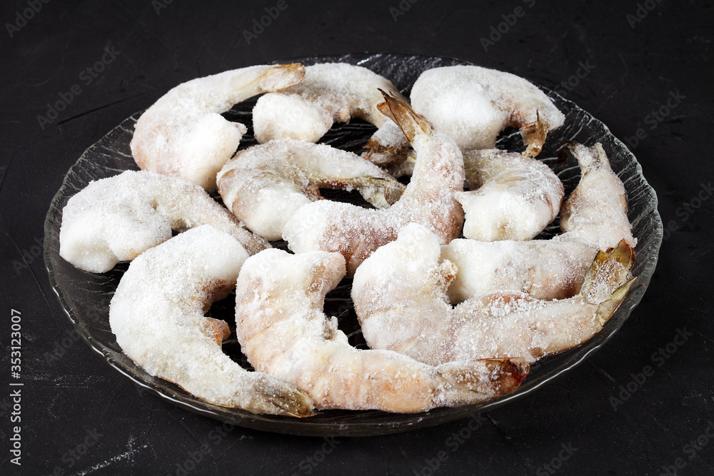 frozen shrimp on a dark table close-up frozen shrimp on a dark table close-up