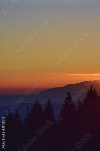 colorfully sunset over the mountains seen from high altitude