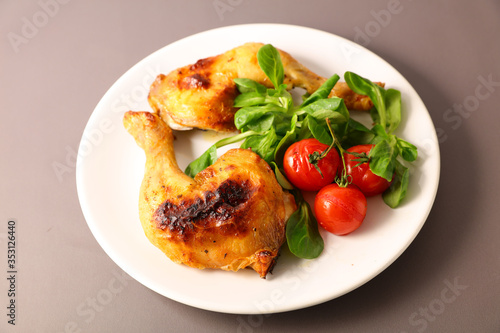 fried chicken leg with lettuce and tomato