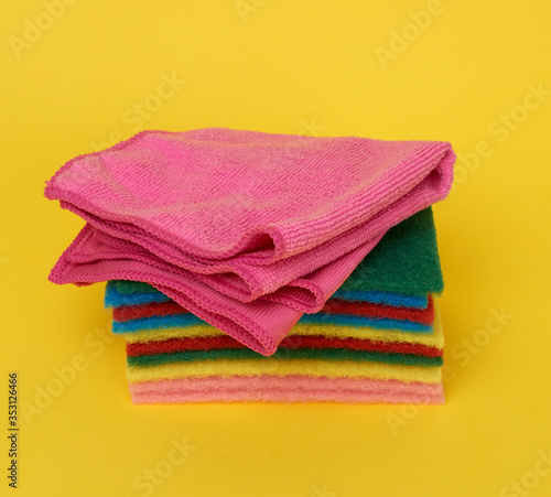 stack of new multi-colored kitchen sponges for washing dishes