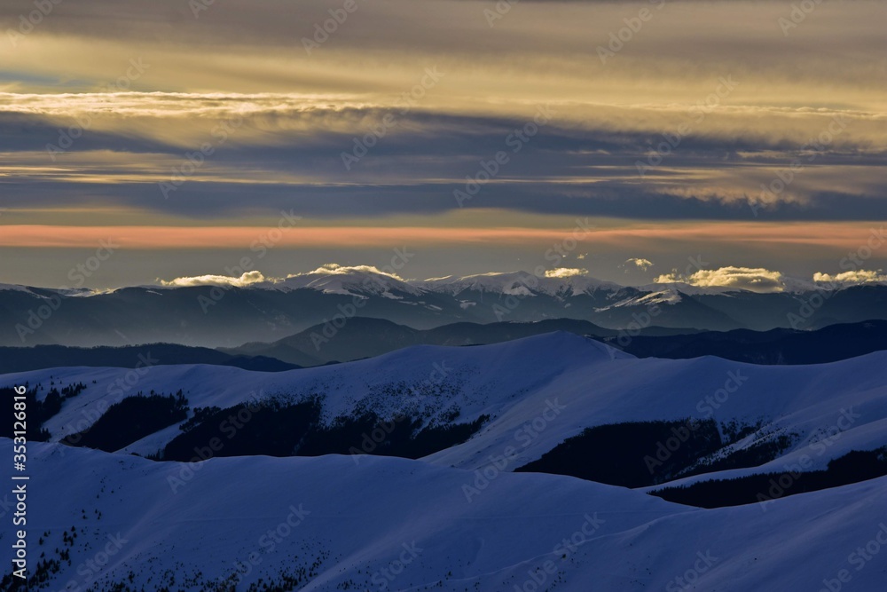 colorfully clouds at sunset in top of the mountain on winter time at high altitudes colorfully clouds at sunset in top of the mountain on winter time at high altitudes