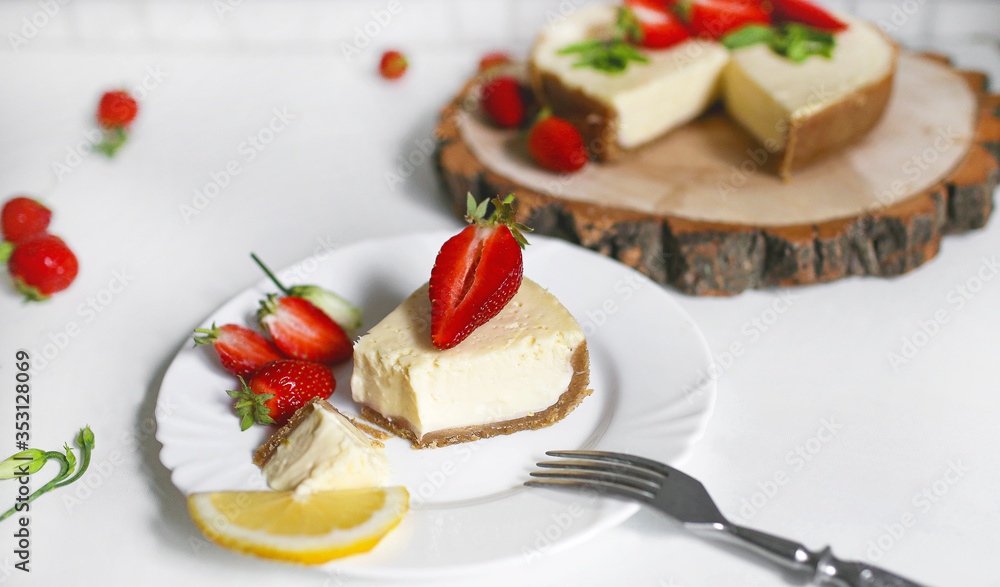 Creamy natural strawberry cheesecake on a white background