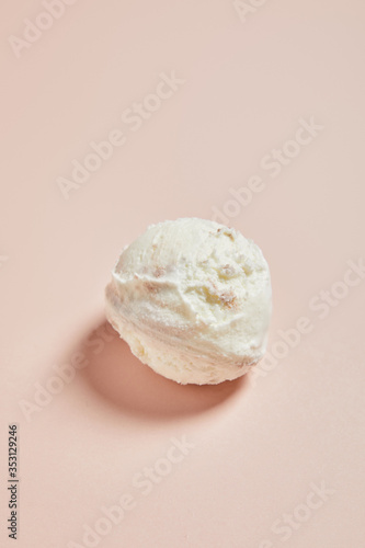 top view of fresh tasty ice cream ball on pink background