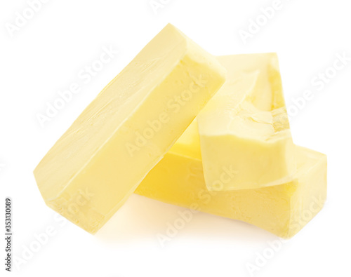 Pieces of butter isolated on white background. Fresh Butter chunks   top view