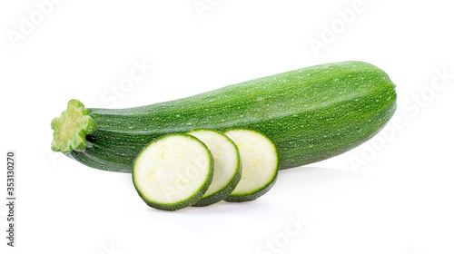 fresh zucchini with slice isolated on white background