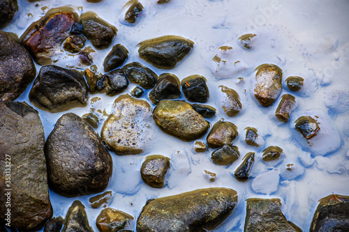 Fototapeta Naklejka Na Ścianę i Meble -  Stones background, water washes stones in a mountain river.