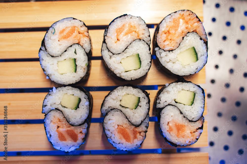 Sushi rolls with nori, salmon, rice, and avocado Sushi rolls with nori, salmon, rice, and avocado