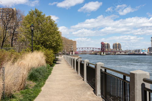 Empty Walkway along the East River on Roosevelt Island during Spring in New York City © James