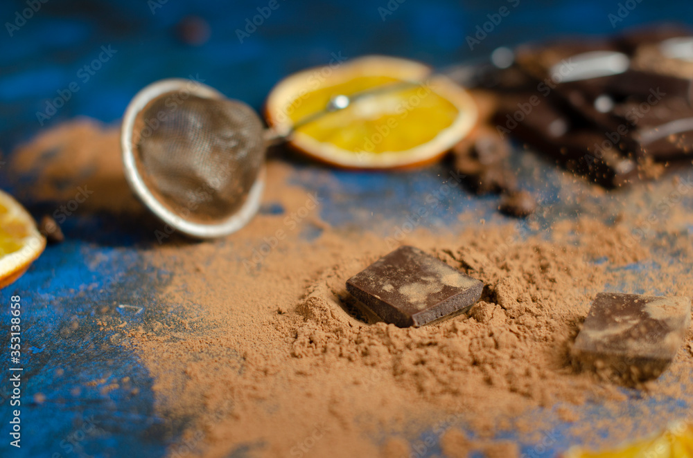 slice of dark chocolate in cocoa powder slice of dark chocolate in cocoa powder